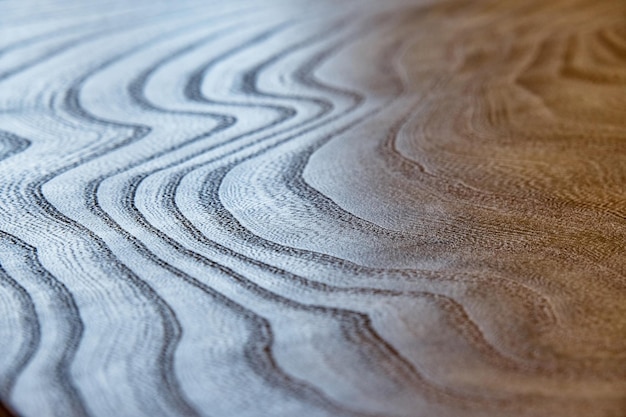 Light brown elm slab countertop with stylish decorative texture pattern as background close view