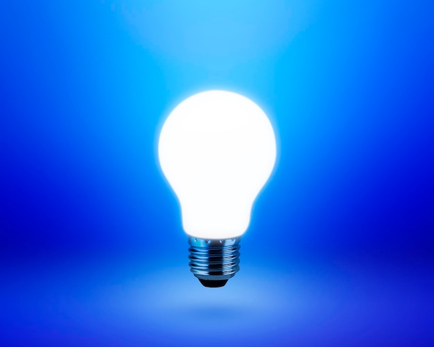 Light bulb on blue background idea concept