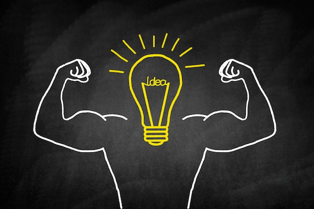 Light bulb drawn in yellow with muscular arms