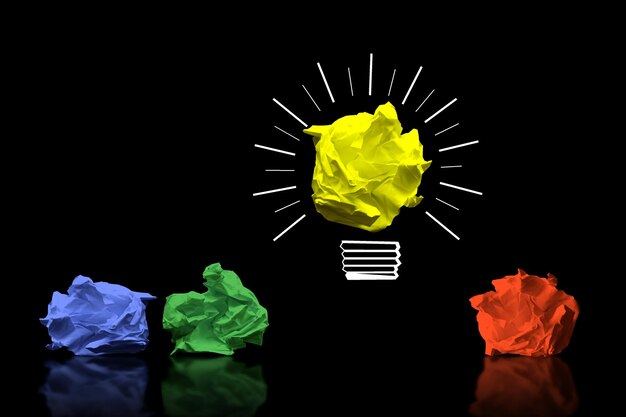 Light bulb icon and colorful crumpled papers idea creativity concept