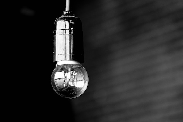 Light bulb is hanging - monochrome