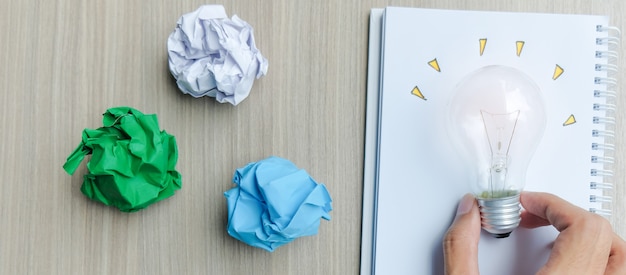 Light bulb or lamp with colorful crumpled paper 