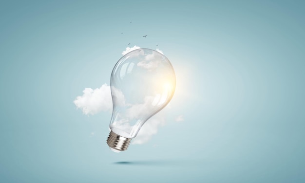 Light bulb on light blue background