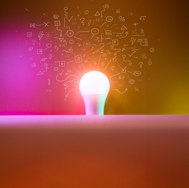 Light bulb outlined with sketches with ideas Colourful rainbow light