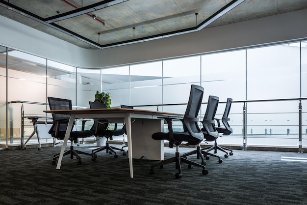 Light conference room with furniture blackboard and city view 3D Render