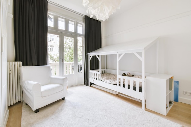 Light cozy baby room with cot