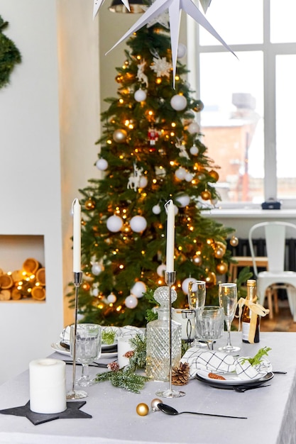 Light festive Christmas interior set table for a festive dinner