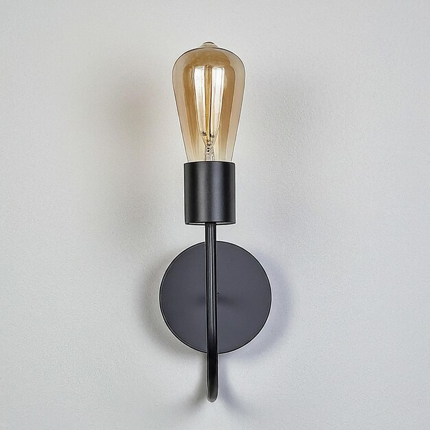 Photo a light fixture with a black base that says quot light quot