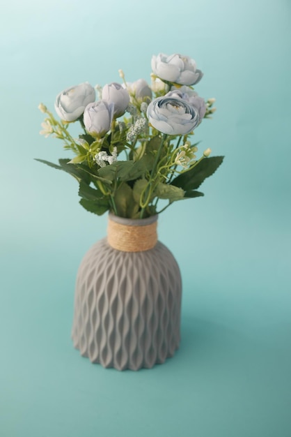 Light green color rose flower in a pot on color background