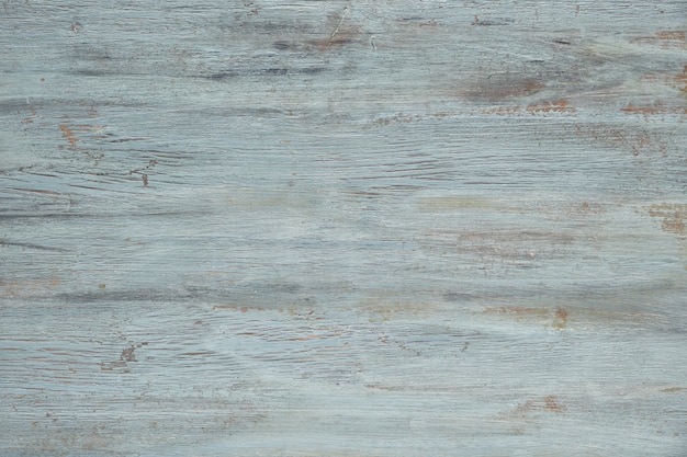 Light grey-blue wooden texture with crackled paint. Aged wood surface,