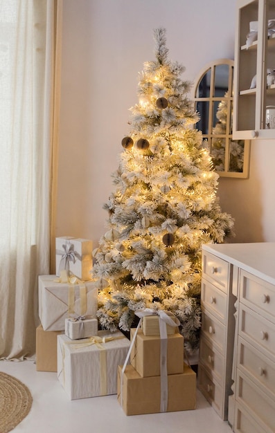 Light kitchen interior with Christmas tree