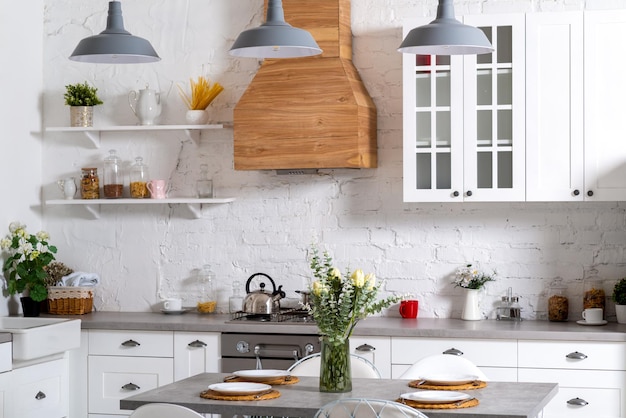 Light kitchen interior with flowers.