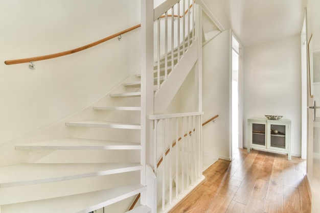 Light narrow hallway with staircase