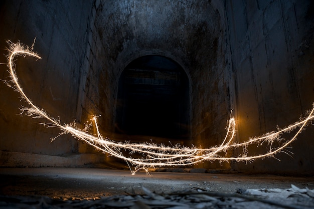 Light painting with a flare in a dark tunnel