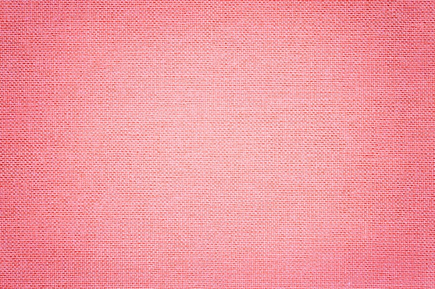 Light pink background from a textile material with wicker pattern, 