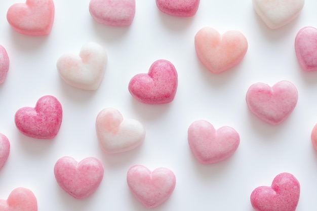 Light pink and white sugartextured hearts arranged in a soft delicate grid with gentle shading