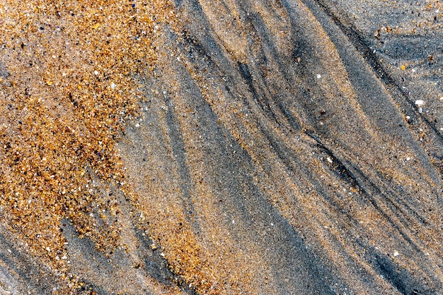 The light plays on the sand of a beach in northern Brittany