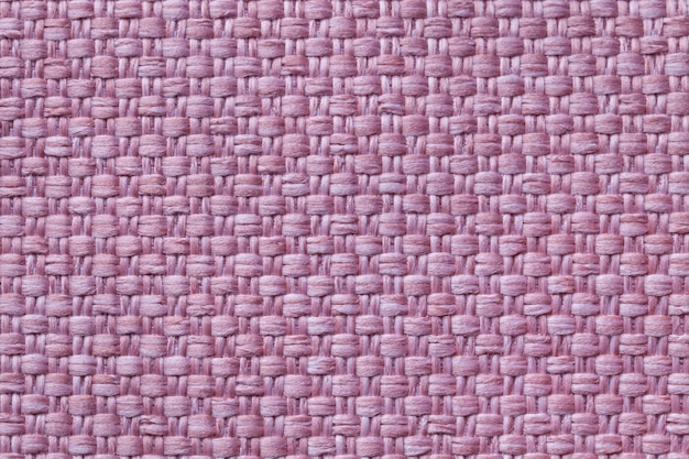 Light purple textile background with checkered pattern, closeup. Structure of the fabric macro.