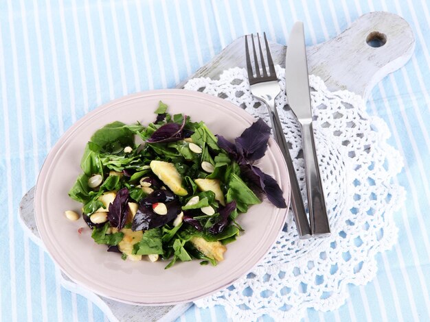 Light salad on plate on napkin