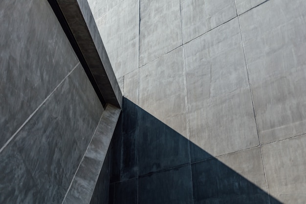 Light and shadow on cement wall of building