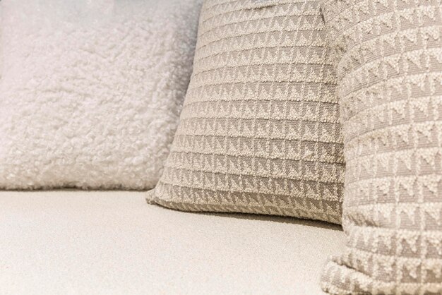 Light soft decorative pillows on the sofa Textiles and decor and interior Closeup