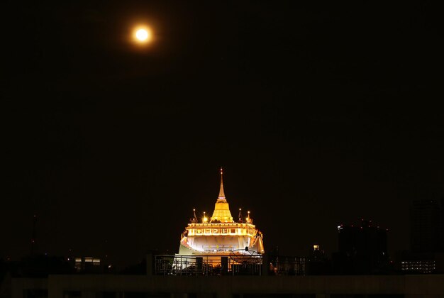 Light up Phu Khao Thong Stupa of Wat Saket Temple on Amazing Full Moon Night in Bangkok  Thailand