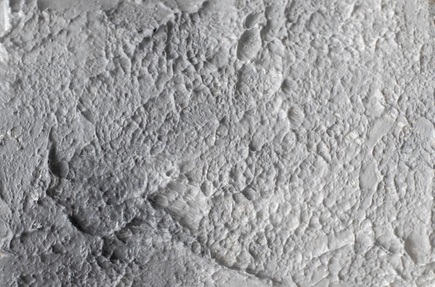 Light wallpaper background textured putty plaster in white and grey Empty design space Marble painting Closeup