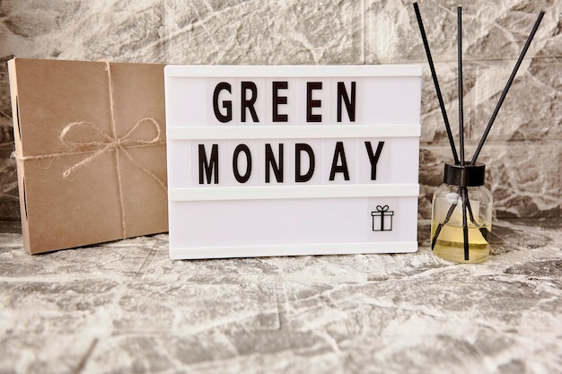 Lightbox Green Monday text crafting gift box and aroma diffuser Concept of online shopping from home Cozy home atmosphere