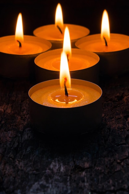 Lighted candles to relax on the wooden background