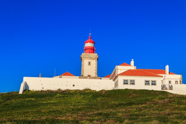 Lighthouse on the cliff at Cabo da Roca Cabo da Roca or Cape Roca is westernmost cape of mainland Portugal continental Europe and the Eurasian land mass