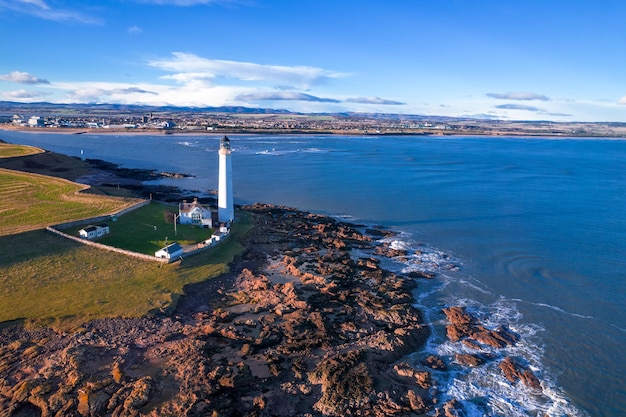 Lighthouse on the coast of the North Sea in Scotland view from above