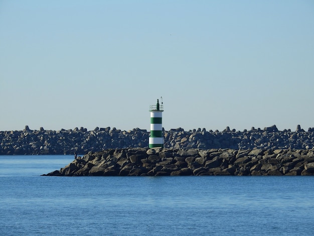 Lighthouse from Cabedelo beach, in Portugal