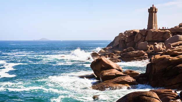 Lighthouse in Ploumanac'h site on rocky coast