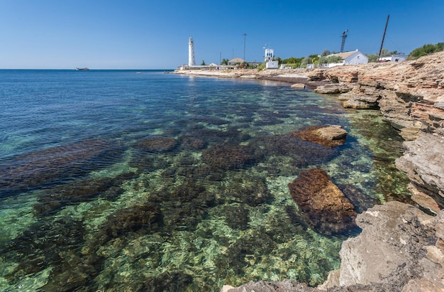 Lighthouse sea and rock blue sky Crimea