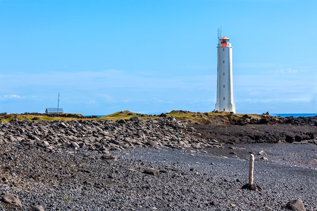 Lighthouse on West Coast of Iceland at sunny weather. Horizontal shot