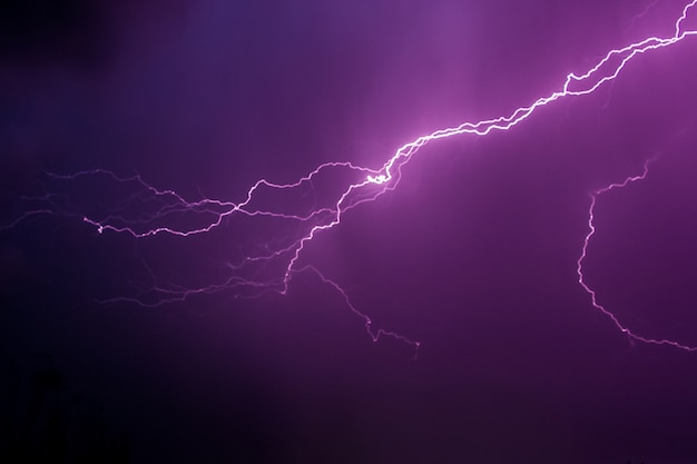 Lightning in the dark sky during a thunderstorm night