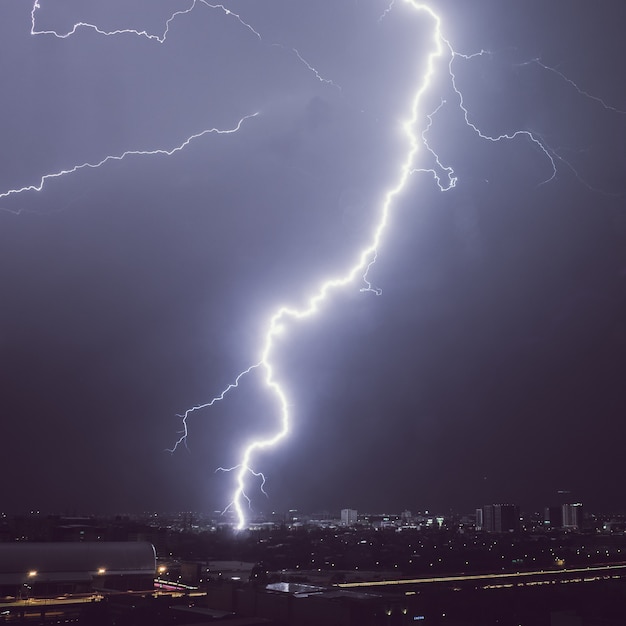 Lightning storm over the city at night.