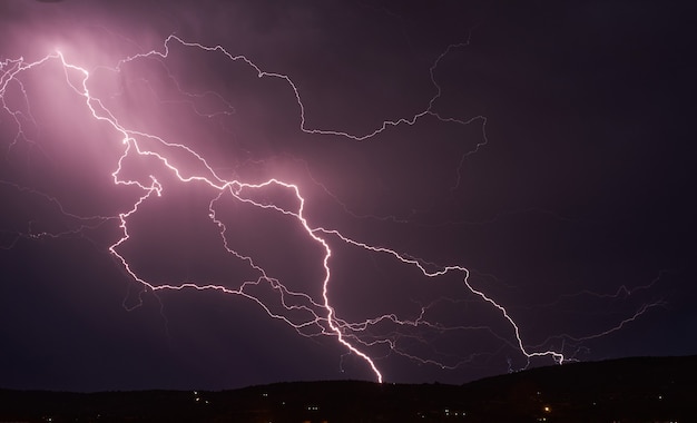 Lightning storm in the dark cloud sky illuminated by the glare of lightning