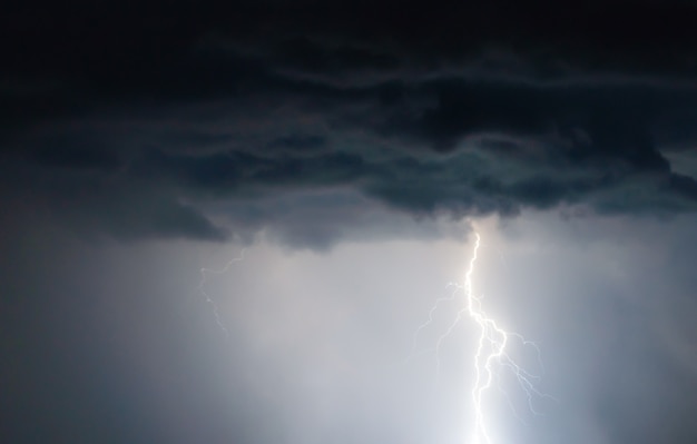 Lightnings and thunder bolt strike at summer storm