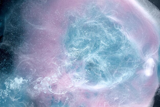 Lilac smoke on black ink background colorful pink fog abstract swirling touch ocean sea azure acrylic pigment paint underwater