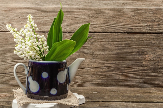 Lily valley flowers bouquet with green leaves Nature object for the design of festive greeting card