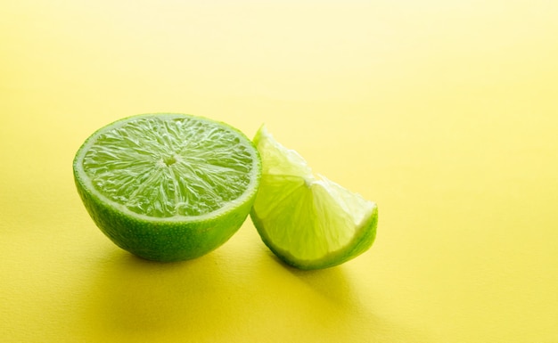 Lime green background. Raw fresh lemon fruit. Citrus food