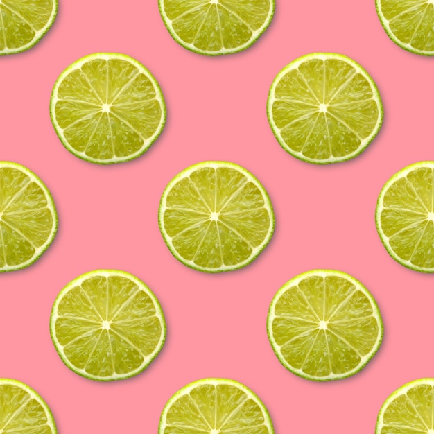 Lime halves on a pink background seamless pattern top view fruit citrus backdrop