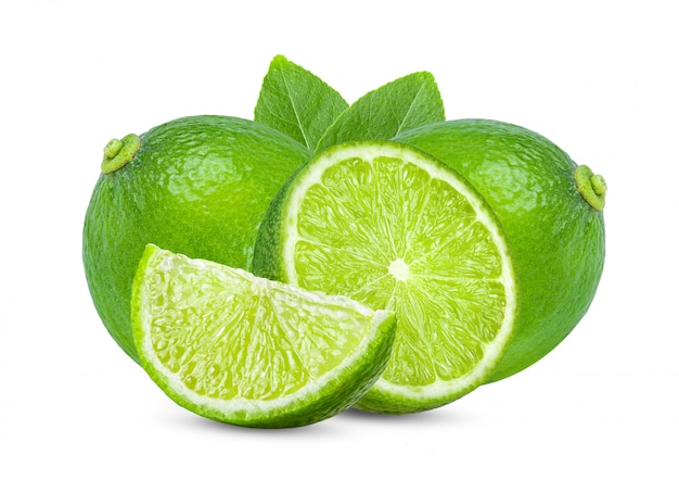 Lime with leaves on white wall