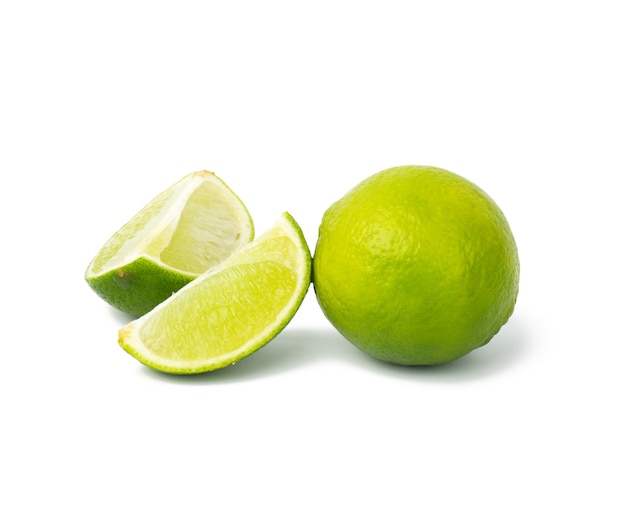 Lime with slice isolated on white background, close up