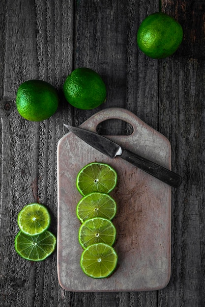 Limes cut on a wooden board