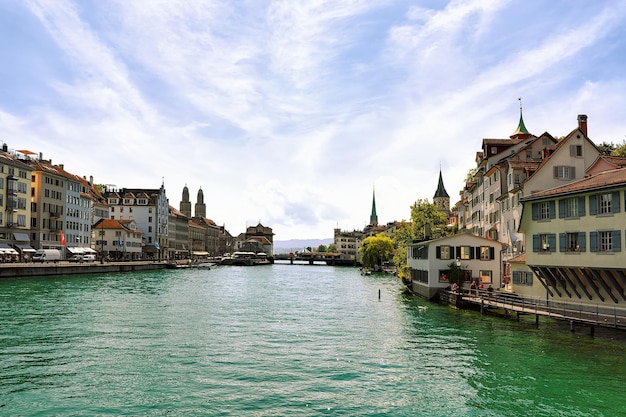 Limmat River quay with spires of three main churches of Zurich - Grossmunster, Fraumunster and St Peter Church, Switzerland