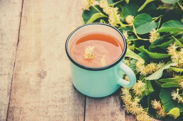 Linden tea and flowers. Selective focus. drink.