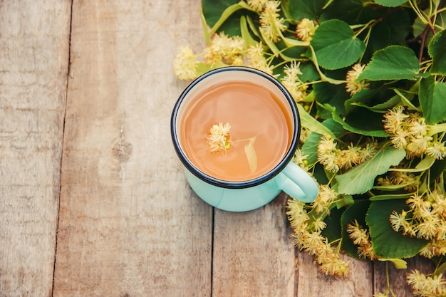 Linden tea and flowers. Selective focus.