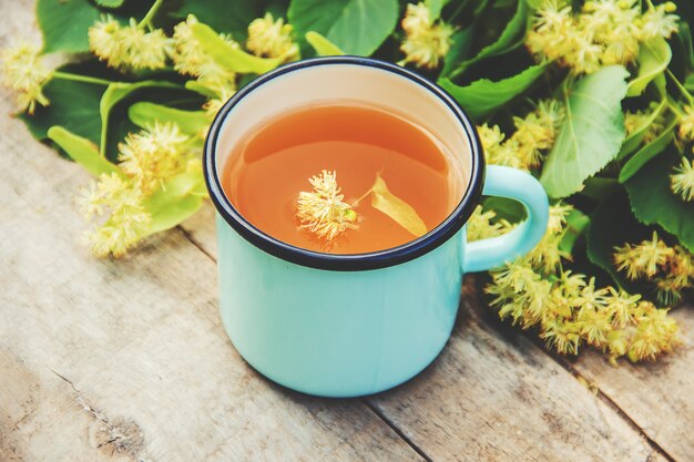 Linden tea and flowers. Selective focus.